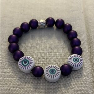 Purple Beaded Stretch Bracelet with Eye Design